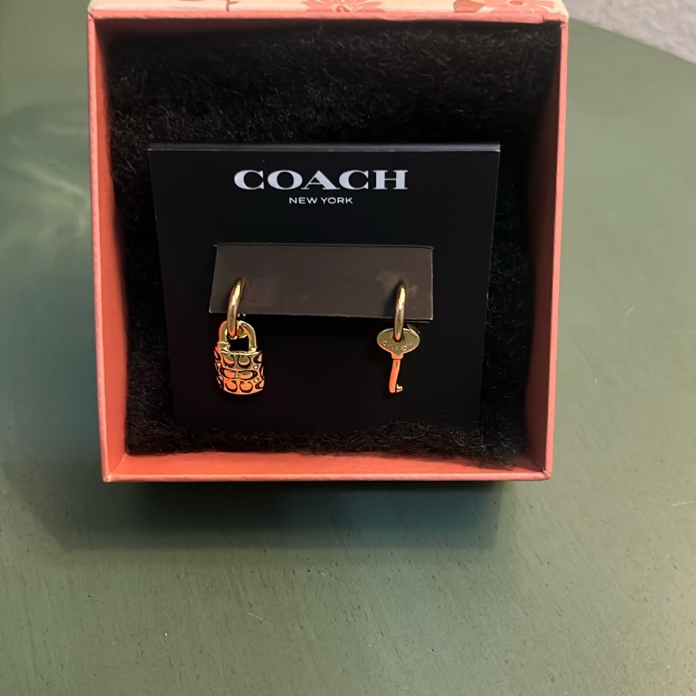 Key and lock COACH earrings